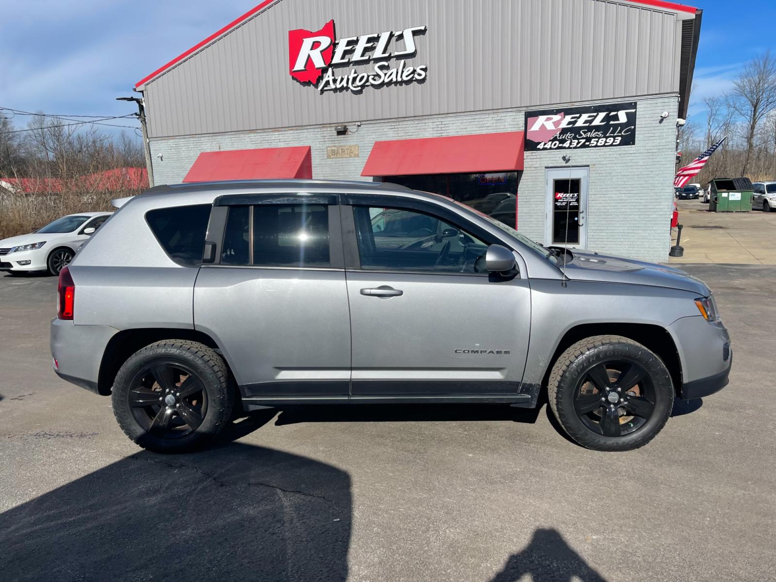 2015 Silver /Black Jeep Compass High Altitude 4WD (1C4NJDEB0FD) with an 2.4L I4 DOHC 16V engine, 6 Speed Automatic transmission, located at 547 E. Main St., Orwell, OH, 44076, (440) 437-5893, 41.535435, -80.847855 - This 2015 Jeep Compass High Altitude 4WD comes with several premium features designed for comfort, convenience, and performance. These include heated leather seats for comfort during colder days, a power sunroof that adds an airy, open feeling to the cabin, a power driver's seat to find the perfect - Photo #5
